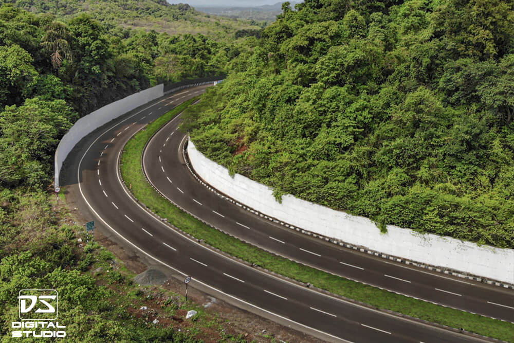 Aerial documentation photograph of a rock cut highway corridor on the Panvel Indapur route