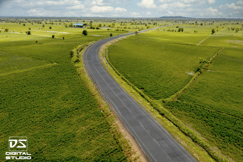 Drone documentation photograph of a curved highway alignment on the Umred Malewada road project