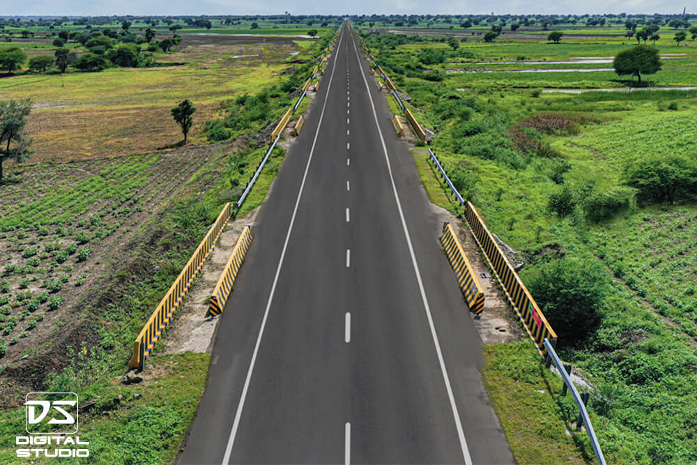 Drone documentation photograph of newly resurfaced asphalt road section on the Shegaon Deori project