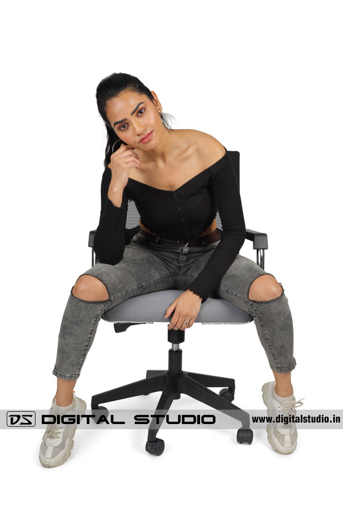 Model sitting on an executive chair