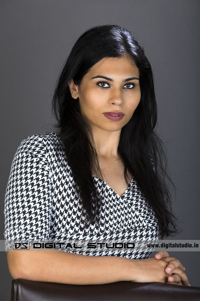 Lady CEO posing with chair