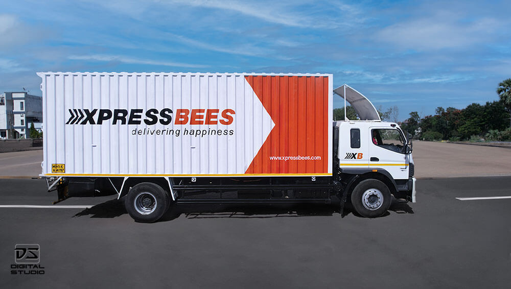 Branding truck photograph showing Busybees courier branding and logistics vehicle identity