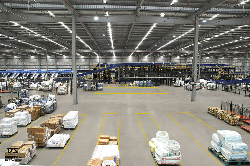 Inside view of automated courier sorting machine in Busybees logistics warehouse