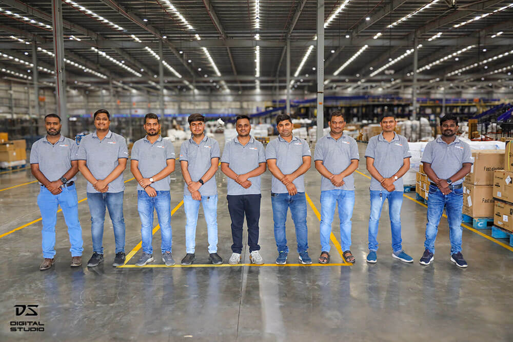 Group photo of Busybees logistics team at the warehouse and sorting center in Surat, Gujarat