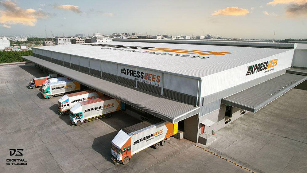 Drone photo of warehouse despatch bay with courier shipments ready for loading and dispatch
