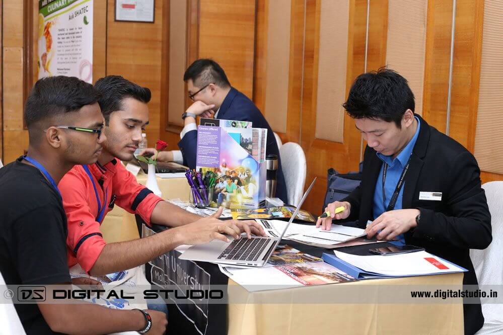 Career counselor with students at education fair