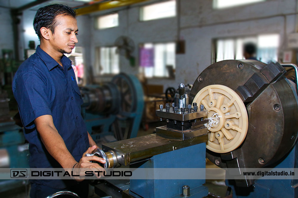 Worker on a grinding machine at Factory in Valsad