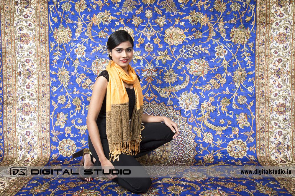 Oriental carpet with model kneeling