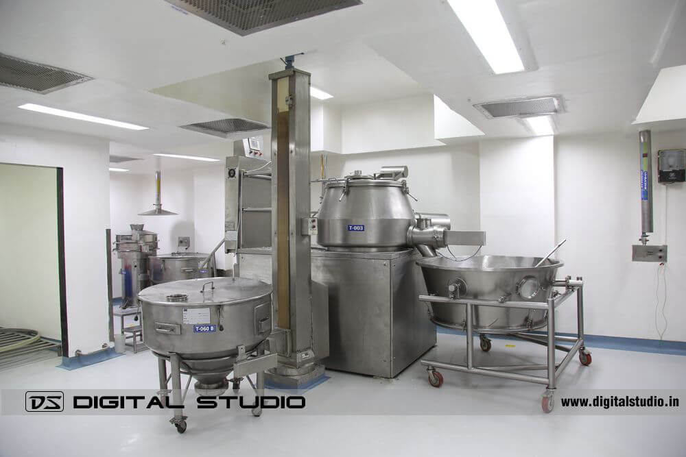 High-resolution image of a tablet coating machine in a pharma facility