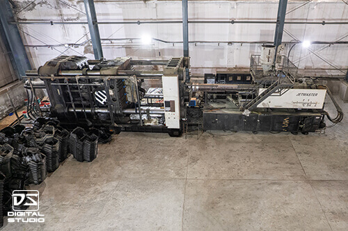 Factory interior photography of injection molding machinery in Delhi NCR