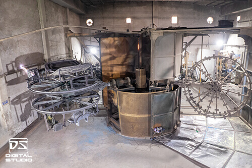 Industrial interior photography of rotational molding machinery for toy manufacturing