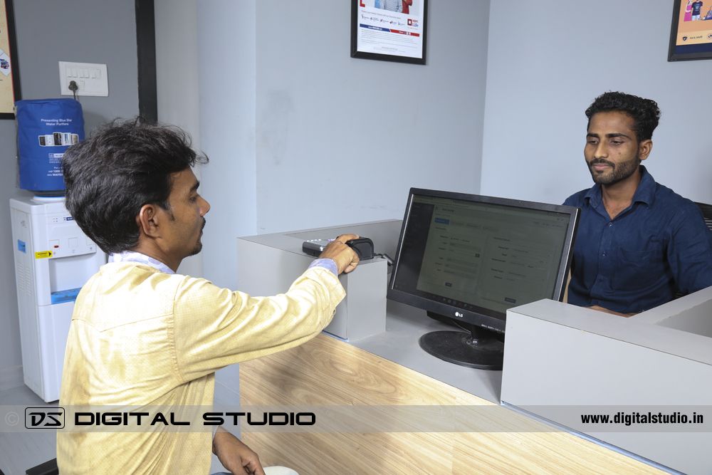 Customer using the biometrics at Vakrangee centre