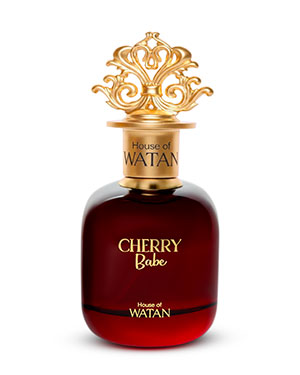 Real commercial product photograph of a premium red glass perfume bottle with an ornate gold cap.